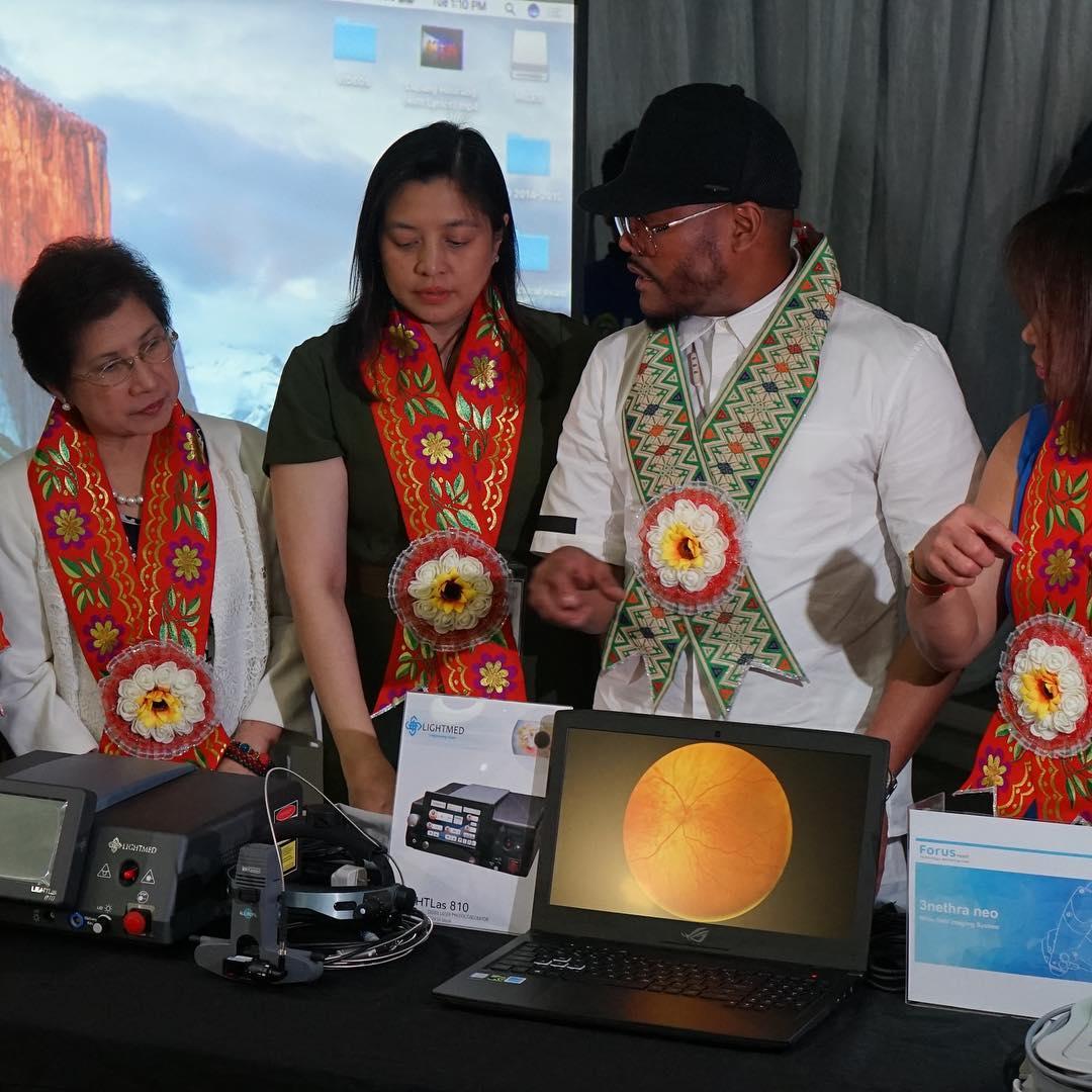 Apl of My Eye - Reviewing retinal scans with clinical partners at a program launch.